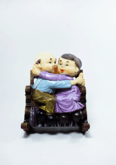 Elderly Couple Resin Figurine Sitting on The Chiar